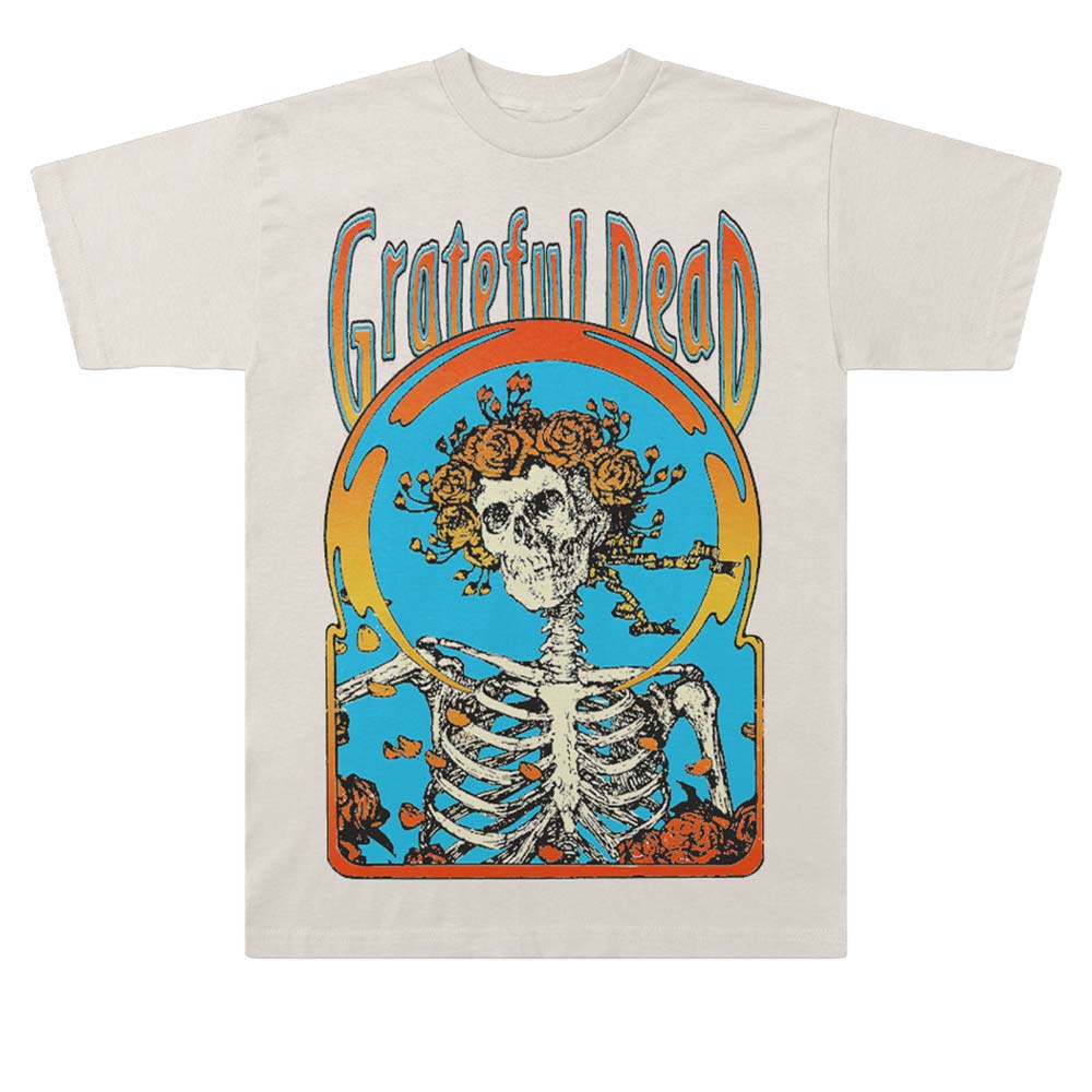 A white Grateful Dead T-shirt featuring a graphic print of a skeleton with a flower in its mouth, surrounded by colorful elements.