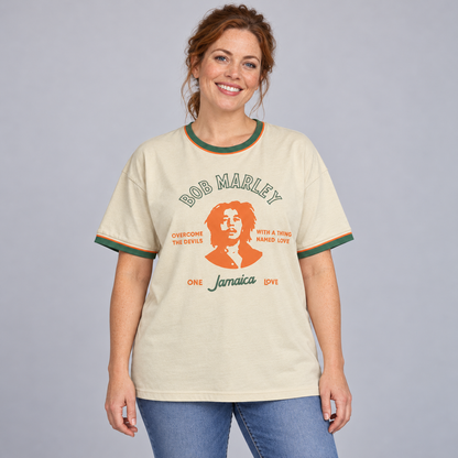 Woman wearing the cream Bob Marley ringer T-shirt with green and orange trim in a relaxed unisex fit.