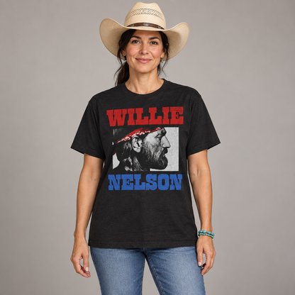 Female country music fan wearing the black Willie Nelson Stare T-shirt with a full-length relaxed unisex fit in a studio.