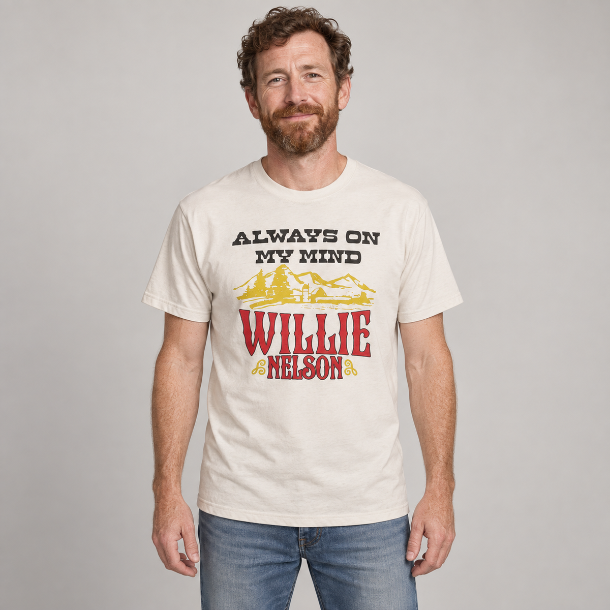 Man wearing the natural Willie Nelson Always On My Mind unisex T-shirt in a studio.