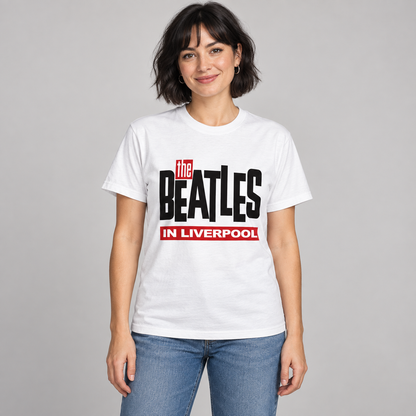 Woman wearing the white The Beatles in Liverpool T-shirt with black and red lettering in a studio.