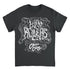 A dark charcoal gray short-sleeve t-shirt with a large white and light gray psychedelic graphic on the front. The graphic features stylized text reading &