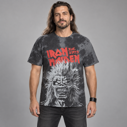 Man wearing the charcoal-wash Iron Maiden Jumbo Scream Head T-shirt with red lettering and oversized Eddie artwork in a studio.