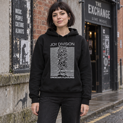 Woman wearing the black Joy Division Unknown Pleasures hoodie outside a music venue.