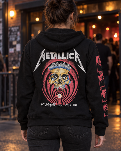 Back lifestyle view of the black Metallica In Vertigo hoodie outside a music venue, showing the skull and red vortex artwork.
