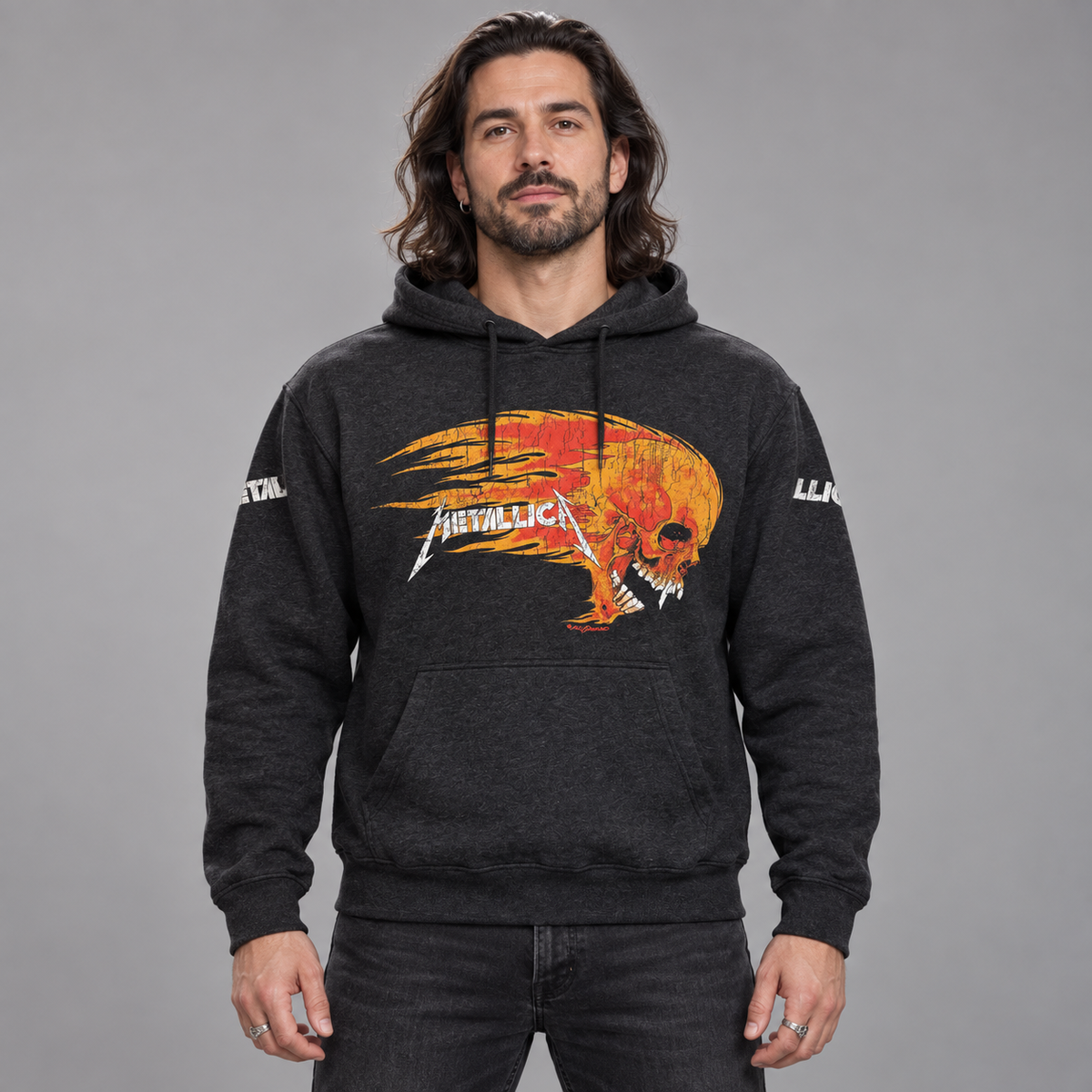 Studio front view of a man wearing the charcoal Metallica Worn Pushead Flaming Skull pullover hoodie.